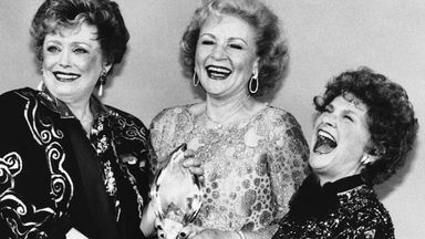 Actresses Rue McClanahan, left, Betty White, centrE, and Estelle Getty, right, share a moment after winning Favourite New Television Comedy Programme at The People's Choice Awards in 1986. Pic: AP